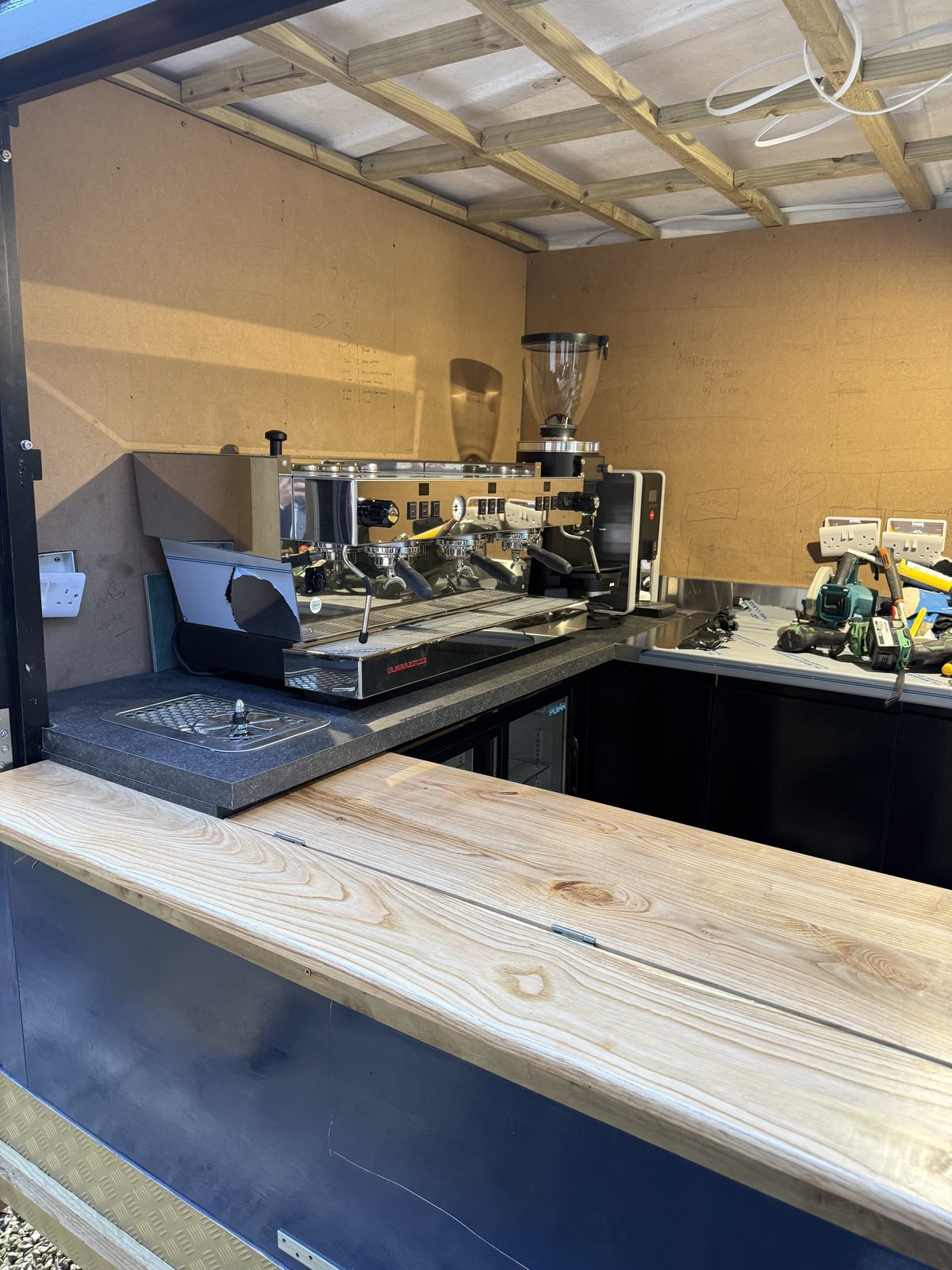 A unit mid-build: timber counter and roof framing