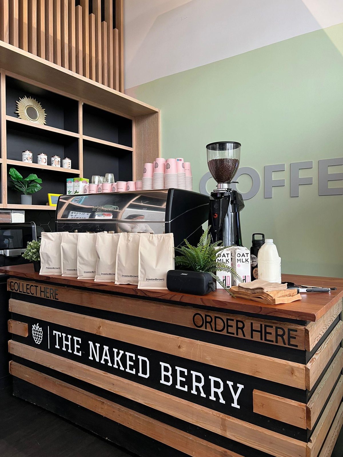 The Naked Berry Coffee Bar timber counter with espresso machine and grinder