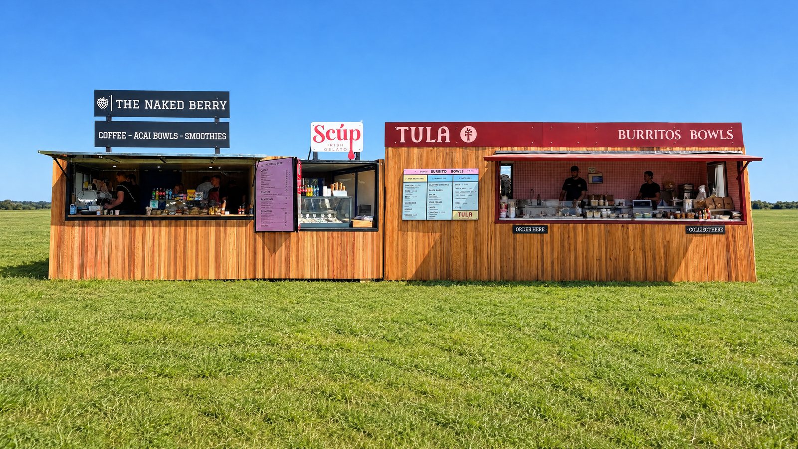 The Naked Berry x Scúp and Tula trailers set end to end in a green field
