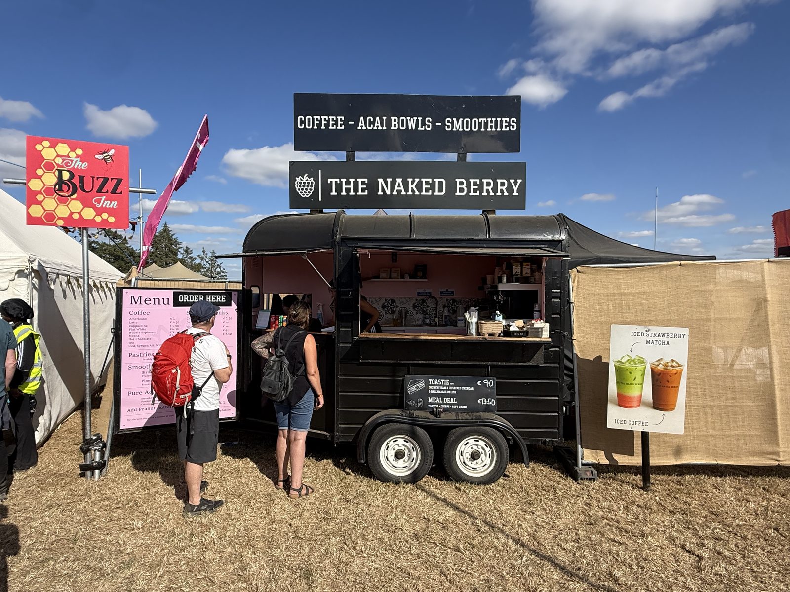 Customers queuing at The Naked Berry horsebox at a festival