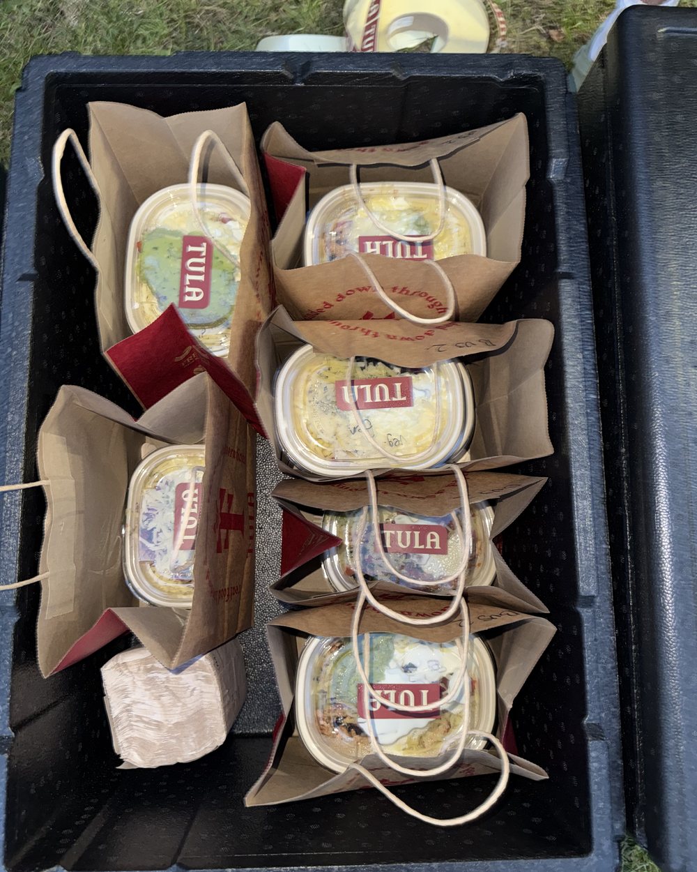 Tula burrito bowls packed in branded bags and labelled for a group order