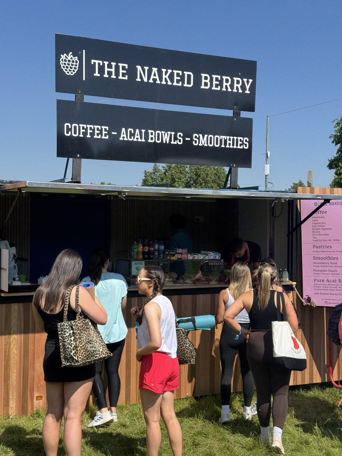 Festival-goers queuing at The Naked Berry x Scúp trailer